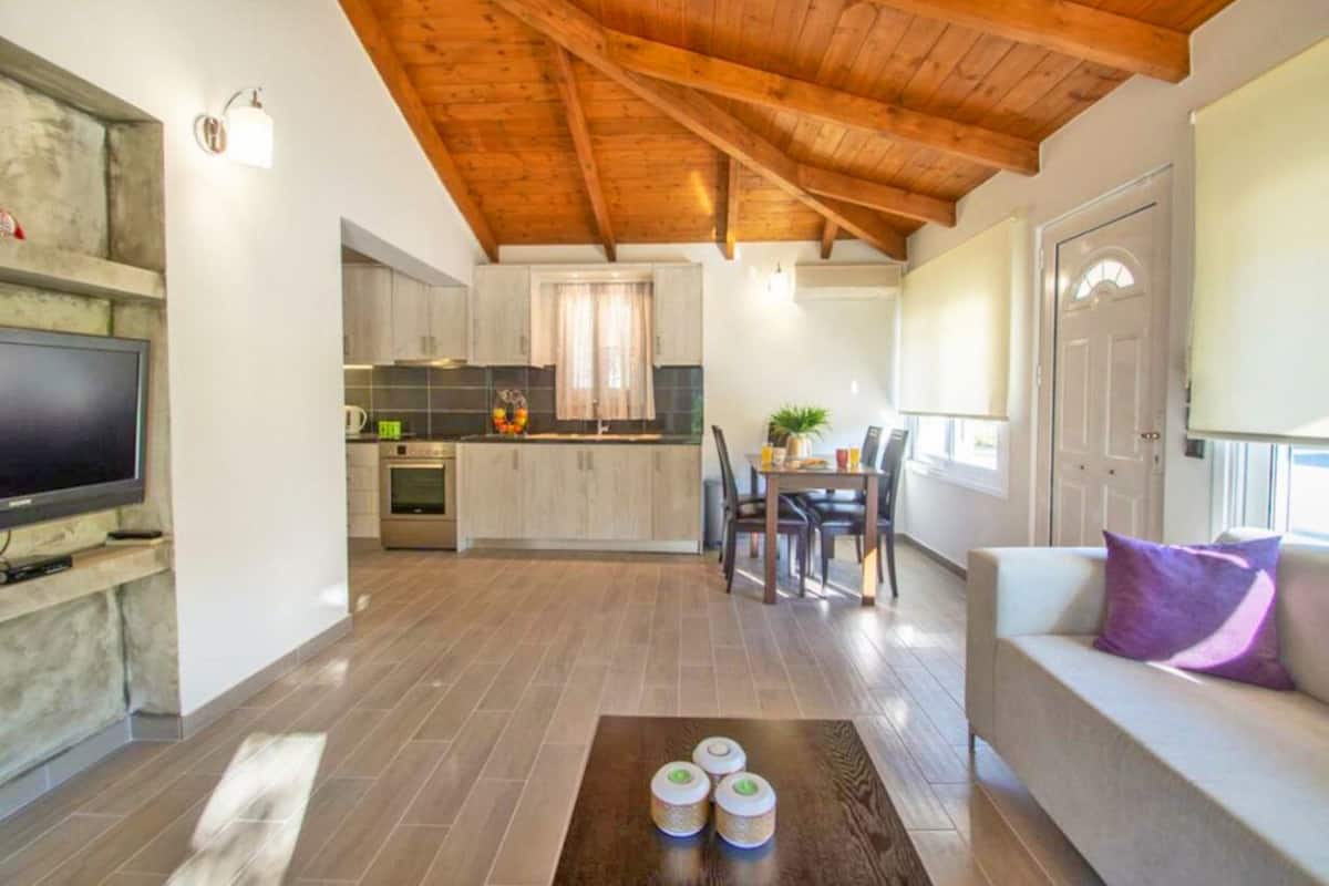 Family Quadruple Room, 2 Bedrooms | Living area | 32-inch flat-screen TV with cable channels, TV