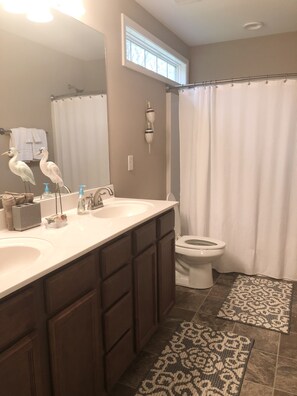 Combined shower/bathtub, hair dryer, towels, soap