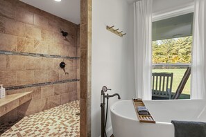 Combined shower/bathtub, hair dryer, towels, soap