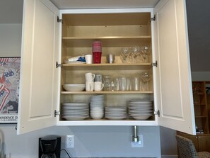 Kitchen essentials at your fingertips, with ample storage for all your dishes and glassware.