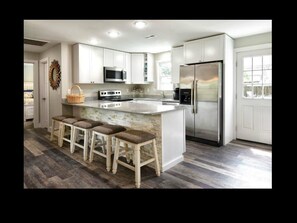 Private kitchen - Discover Anchors Down, a charming 3-bedroom duplex in Oak Island, perfect for family getaways! (Oak Island)