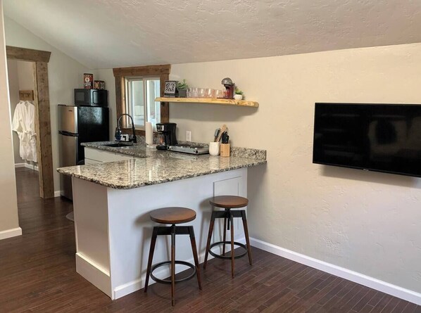 Fridge, microwave, stovetop, coffee/tea maker