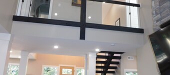 Luxurious, modern 5 bedroom/4 bathroom cabin nestled in the pines. Sleeps 16.