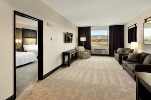 Elite Suite, Multiple Beds | Living area | 48-inch LED TV with satellite channels, TV