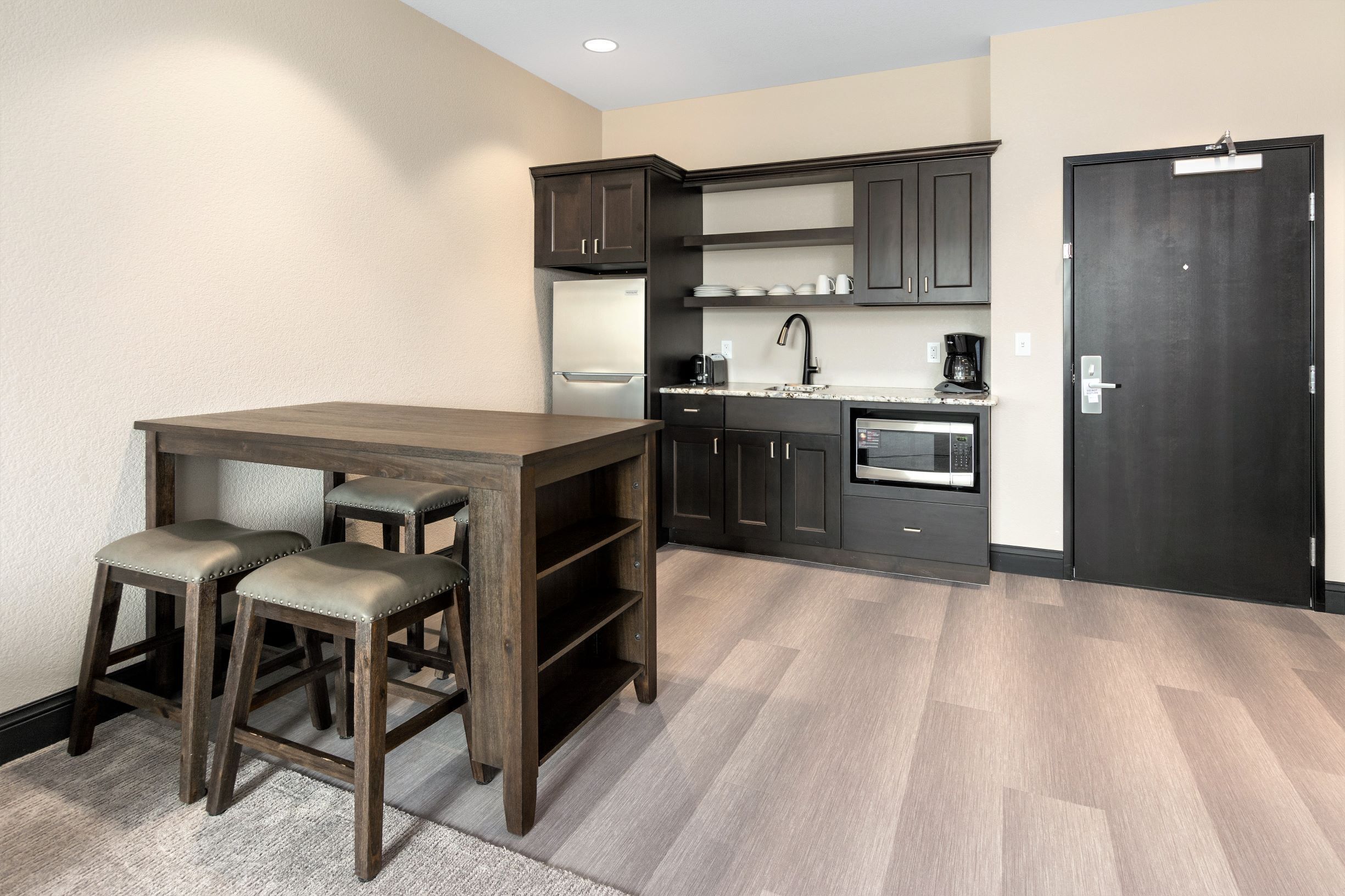 elite suite, multiple beds | private kitchen