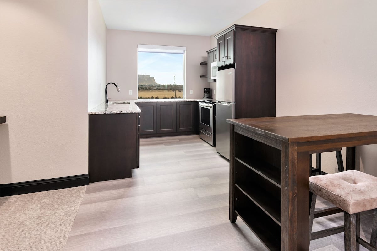 premium suite, multiple beds | living area | 48-inch led tv with satellite channels, tv