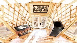 An attic room with a wooden ceiling, a TV, and a fireplace. - Cozy Blue-Beary great f/ couples or small family, Huge Deck w/Privte Hot Tub (Pigeon Forge)