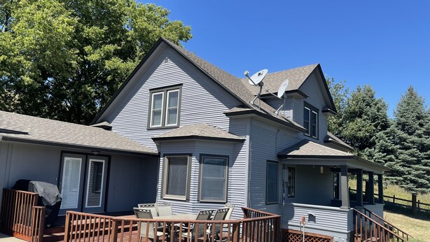 A two-story house with a covered deck and a porch. - Heart of the Loess Hills (Moorhead)