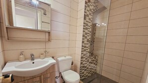 A bathroom with a sink, toilet, and shower. - Corfu Dream Holidays  Apartments (Corfu)