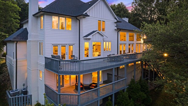 A large, multi-story house with multiple balconies and large windows, surrounded by trees. - Luxury Estate w/ Hot Tub & Game Room + Biltmore Pass | 18 Min to Asheville (Asheville)