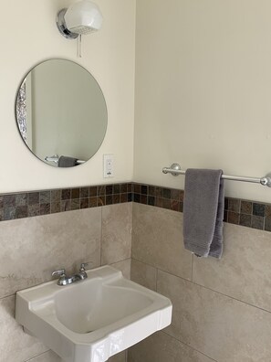 Bathtub, hair dryer, towels, soap