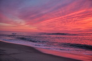 A beach with waves and a sunset sky. - Great Home with Game Space, 0.8 miles from Cooks Brook Beach! (Eastham)