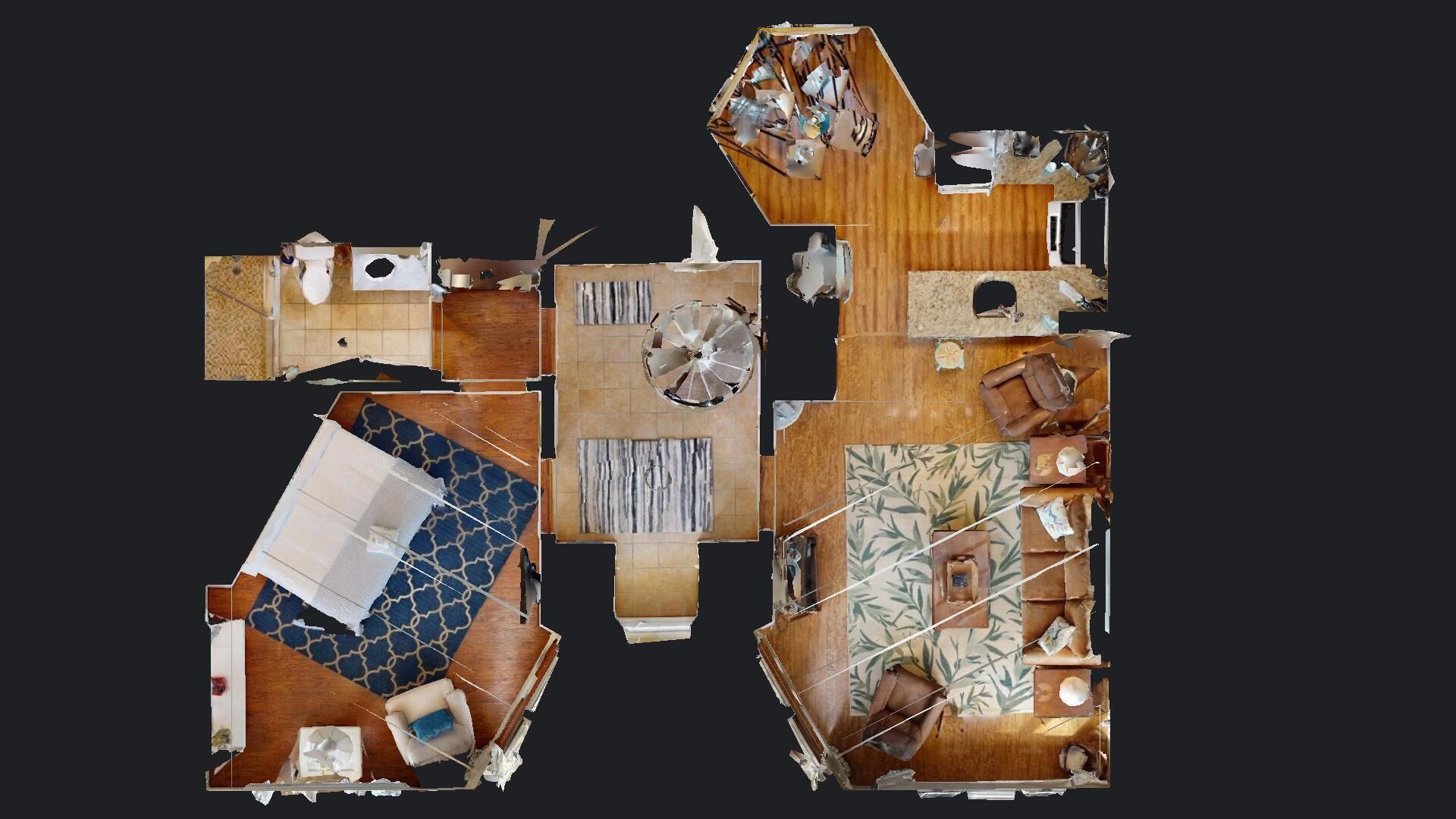 Un aménagement de chambre d’hôtel comprenant un grand lit, un bureau, une chaise, une petite table et une armoire.