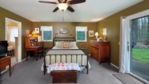 A bedroom with a bed, dresser, desk, and television. - 2 Miles to Good Harbor Beach, Pet Friendly (Cedar)
