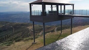 A metal observation tower with a roof, offering panoramic views of a hilly landscape. - Hotel And Spa Alfandega Da Fe (Alfandega da Fe)