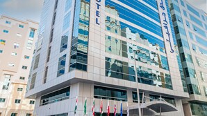 A modern hotel building with a prominent sign reading "CRAVITY HOTEL". - Gravity Hotel (Abu Dhabi)