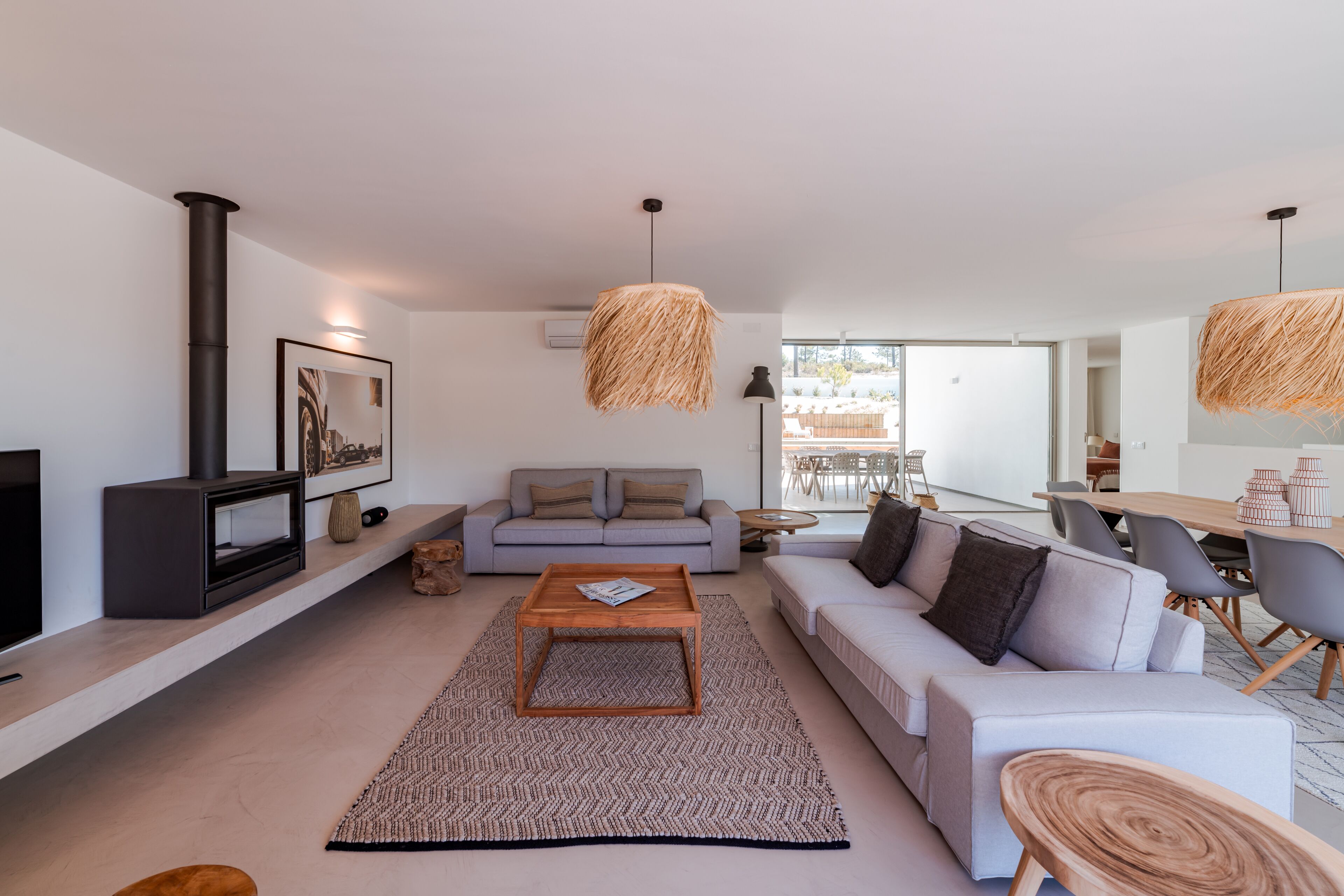 A modern living room with a sofa, coffee table, and TV.
