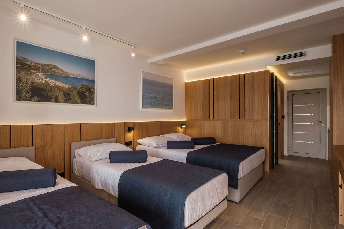 Deluxe Quadruple Room | Egyptian cotton sheets, premium bedding, in-room safe, desk