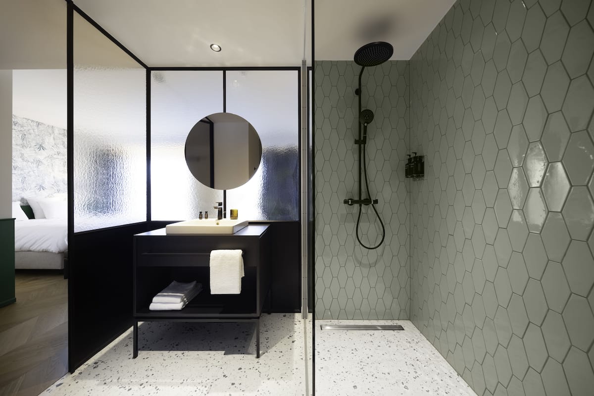 shower, rainfall showerhead, hair dryer, towels