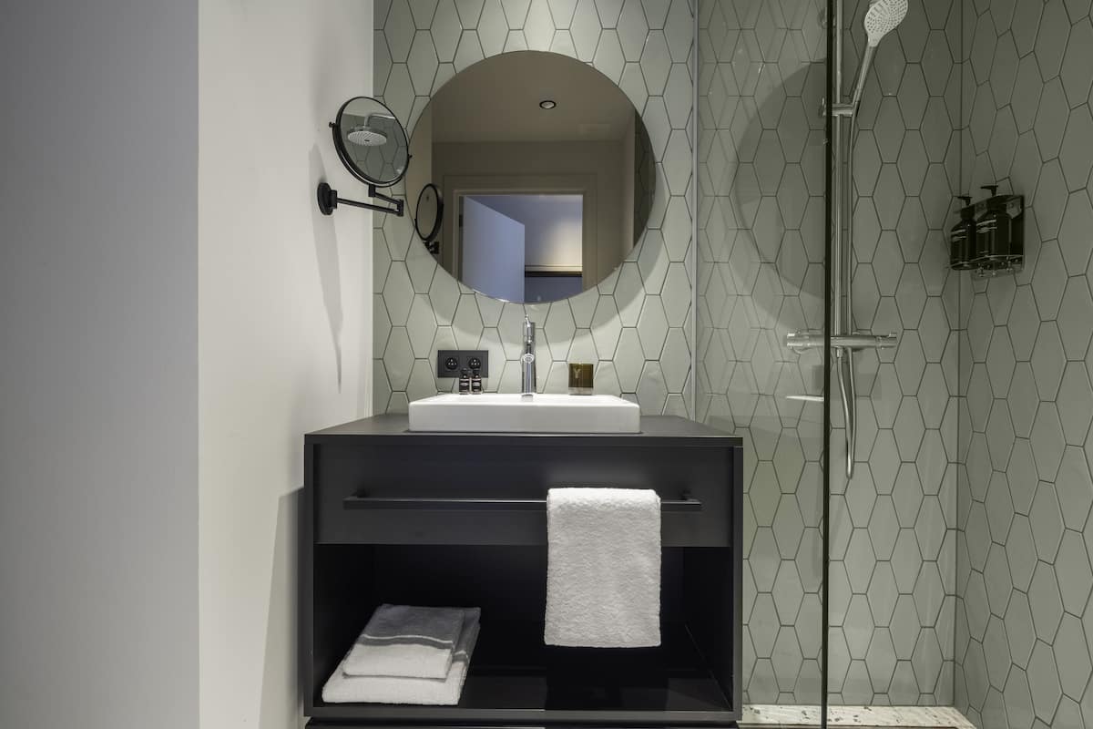 shower, rainfall showerhead, hair dryer, towels