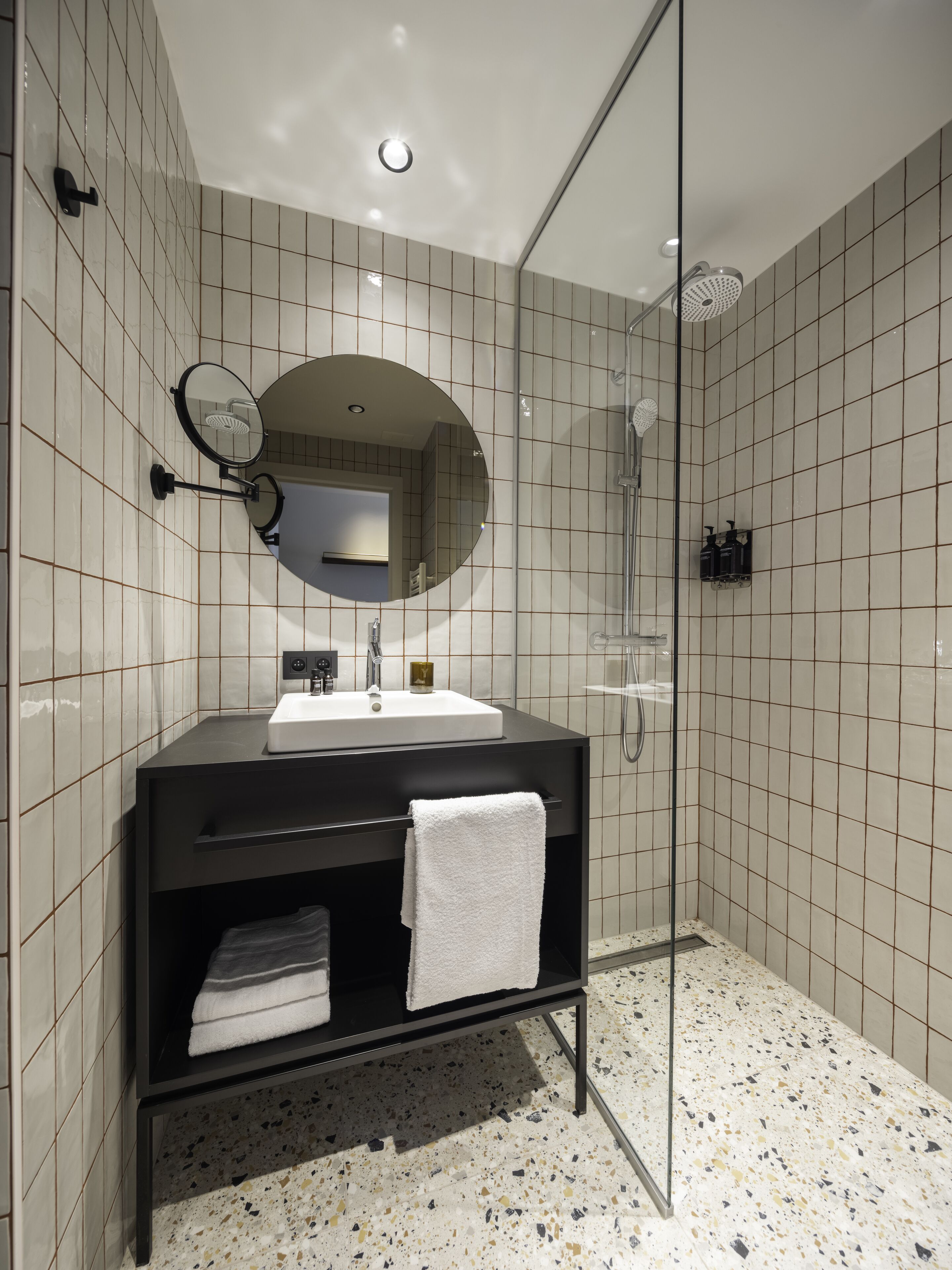 not-so-standard room with a view | bathroom | shower, rainfall showerhead, hair dryer, towels