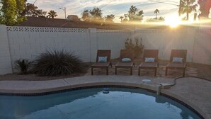 A swimming pool with a tiled edge, surrounded by a low white wall with a patterned top. - Beautiful, privately owned, Family Friendly, 3BR, Heated Pool, A+ Location! (Scottsdale)