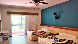 A hotel room with two beds, a desk, and a balcony. - Hotel Mariachi by Kavia 5th Av (Playa del Carmen)