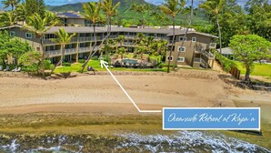 A resort with multiple buildings, a beach, and palm trees. - Beach Front, Pool, Amazing Sunrise! Welcome to Oceanside Retreat At Kapaa, Kauai (Kapaʻa)