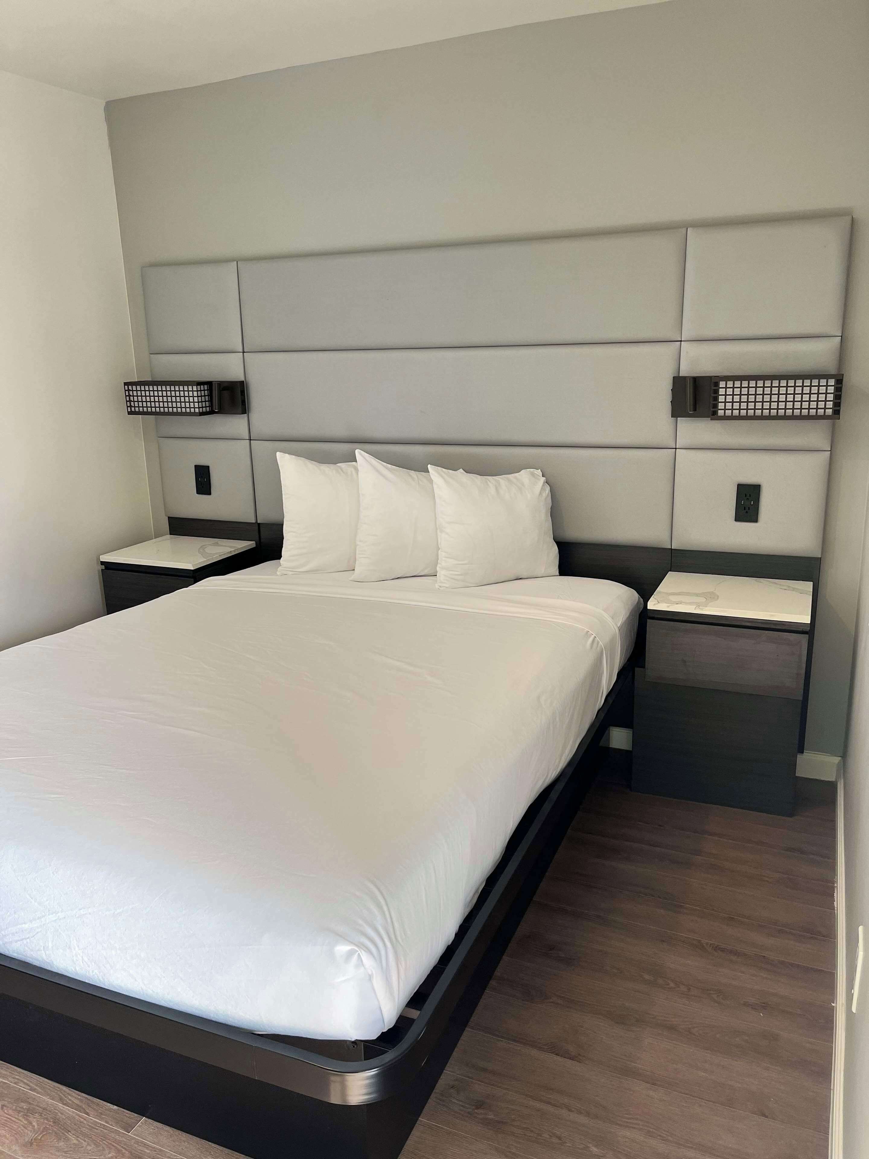 desk, iron/ironing board, bed sheets