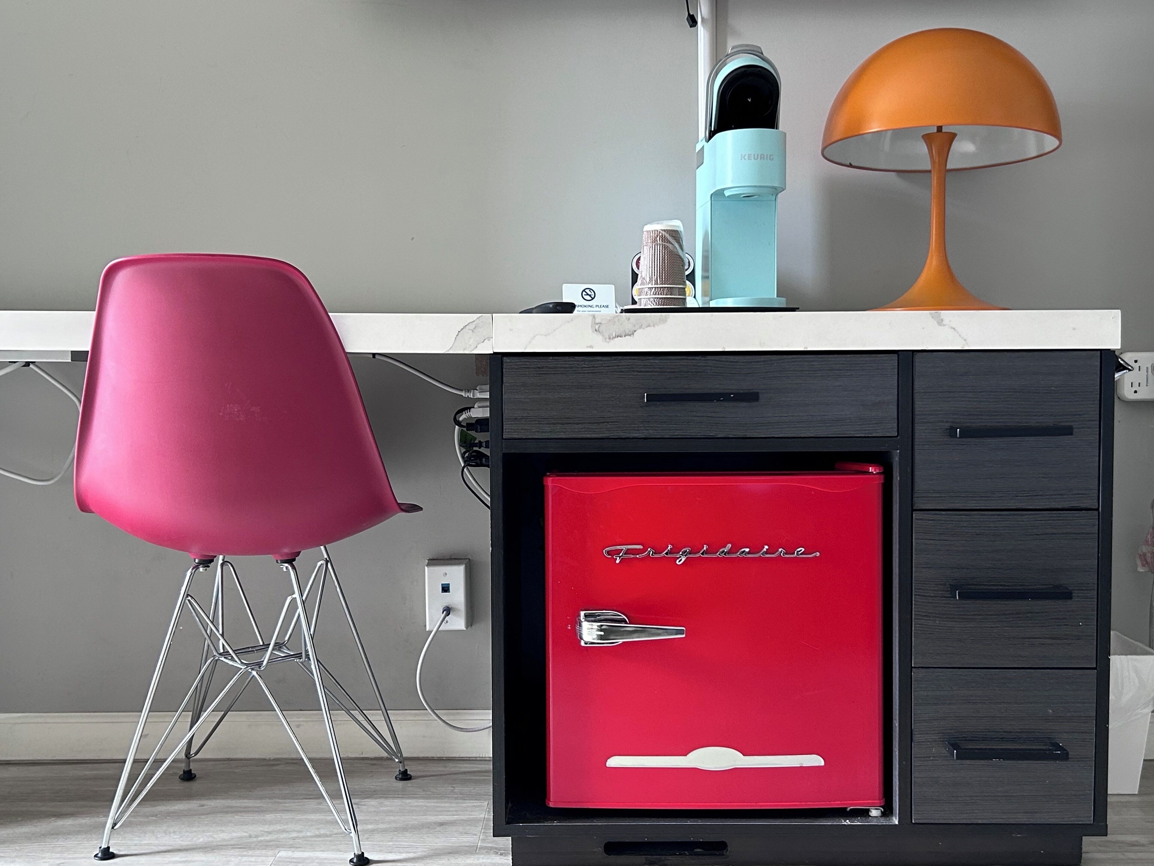 desk, iron/ironing board, bed sheets