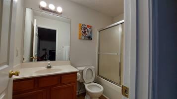 Combined shower/tub, hair dryer, towels, soap