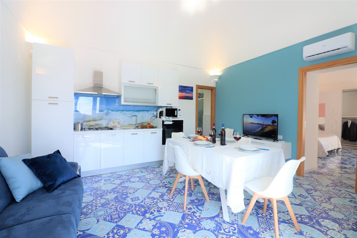 Superior appartement | Woonruimte | Een flatscreentelevisie
