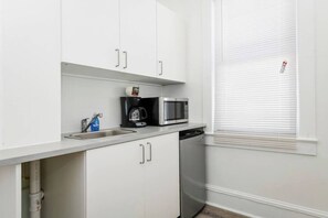 Mini-fridge, microwave, stovetop, coffee/tea maker