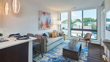 Luxury Apartment | Living area | 50-inch LED TV with cable channels, TV