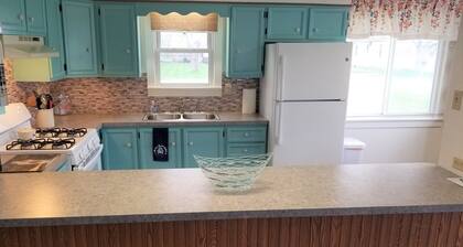 Open concept 2 bedroom ranch with attached garage and deck