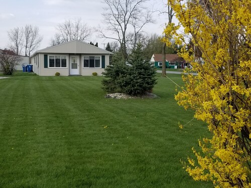 Open concept 2 bedroom ranch with attached garage and deck