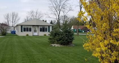Open concept 2 bedroom ranch with attached garage and deck