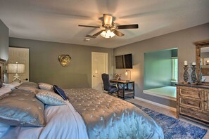 A bedroom with a bed, a desk, a chair, a dresser, and a ceiling fan. - 16-Acre Pilot Point Ranch: Private Pond (Pilot Point)