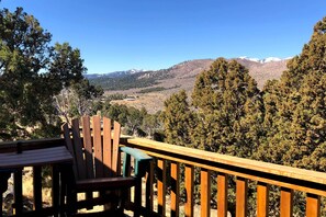Enjoy breathtaking views of the surrounding mountains from this deck.