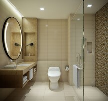 A modern bathroom with a large mirror, a sink, a toilet, and a shower area.