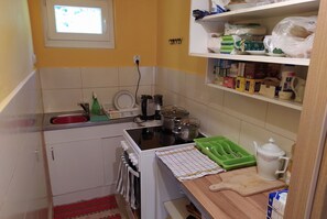 Enjoy cooking in this well-equipped kitchen with a central island and ample workspace.