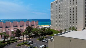 A hotel with a view of the beach and ocean. - Steps from the beach! Pool, Pickleball, and Tennis Courts! (Miramar Beach)