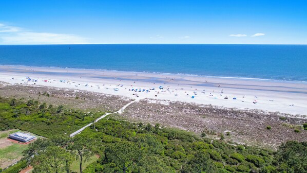 Enjoy a serene beach experience with access to the ocean and lush surroundings.