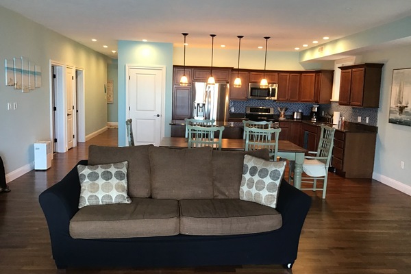 L02 has an open concept living room, dining room and kitchen with lake view