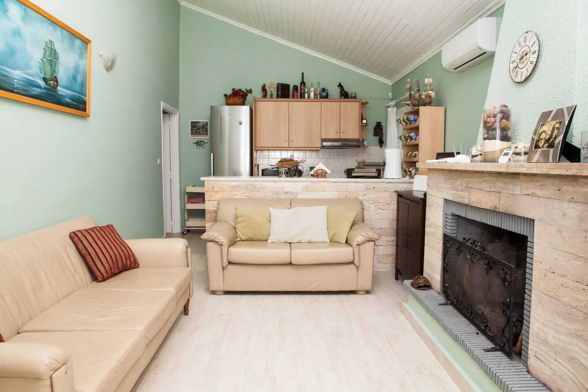 Villa | Living room | 30-inch TV with cable channels, fireplace