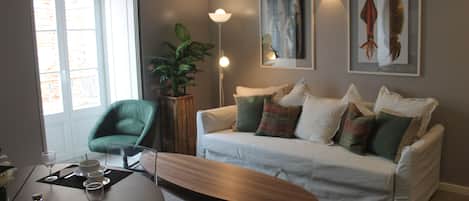 Family Apartment, 1 Bedroom | Living area | 50-cm flat-screen TV with cable channels