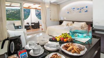 Deluxe Suite, Terrace, Sea View | Premium bedding, minibar, in-room safe, individually decorated