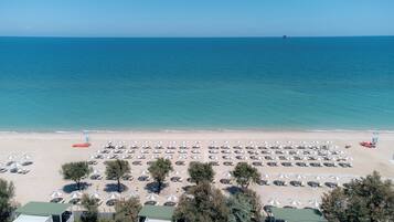 Private beach, black sand, sun loungers, beach umbrellas