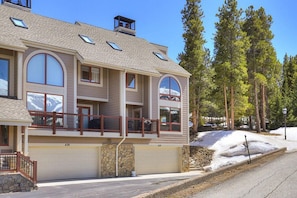 A multi-story house with a garage, large windows, and a balcony. - Ski in/Ski Out 100 yards, Masive Views, On Shuttle Route, Hot Tub, Fireplace (Breckenridge)