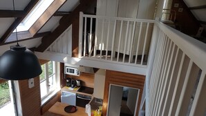 A loft-style apartment with a kitchen, dining area, and a balcony. - House (Condette)